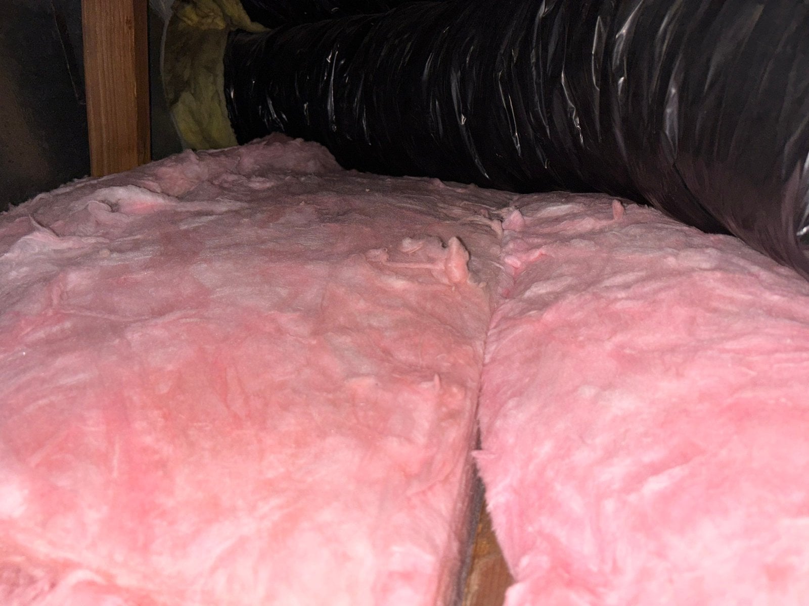 New insulation laid around ducts in a Los Angeles attic