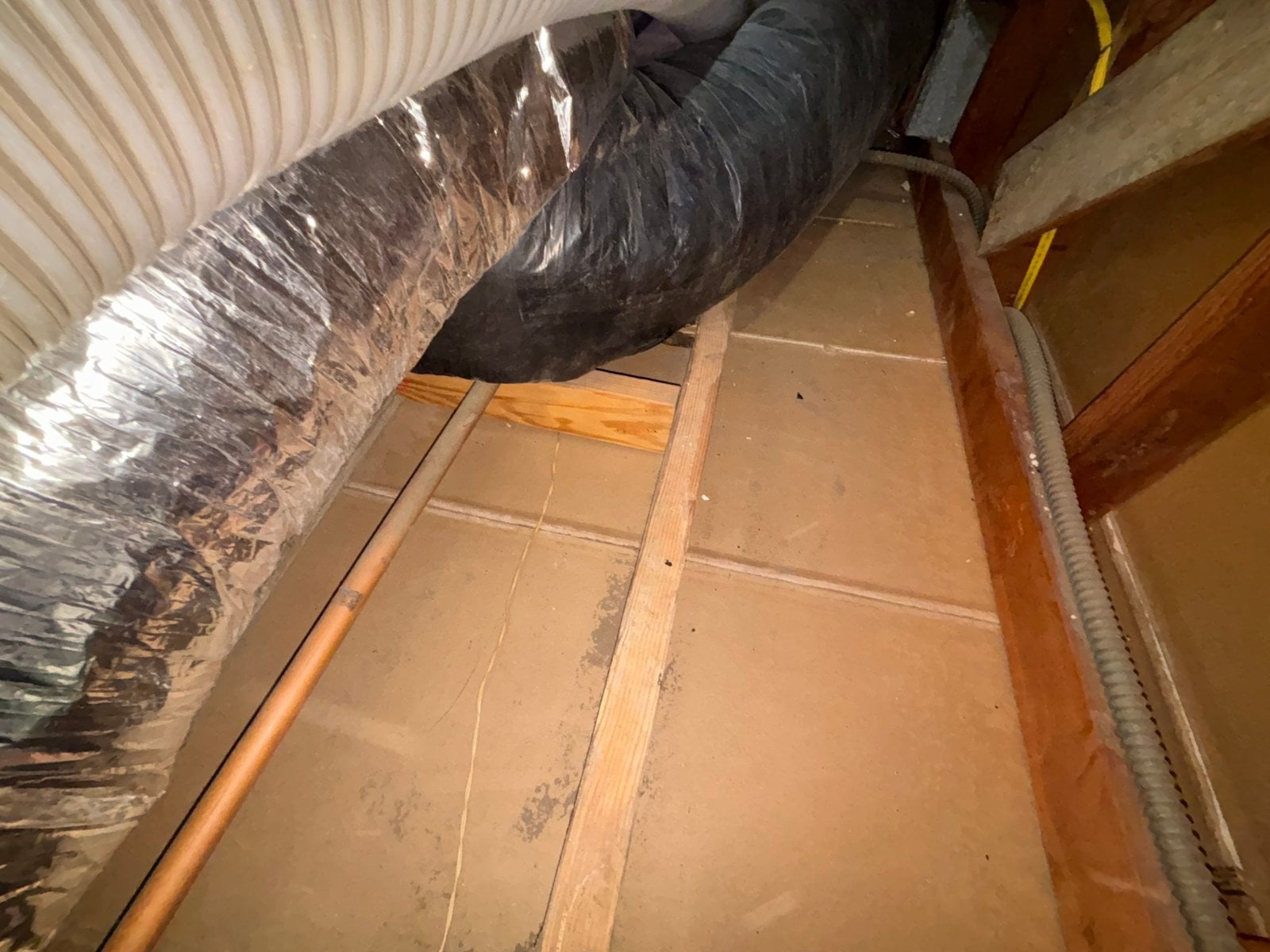 New flexible air ducts over a cleared attic deck in Los Angeles
