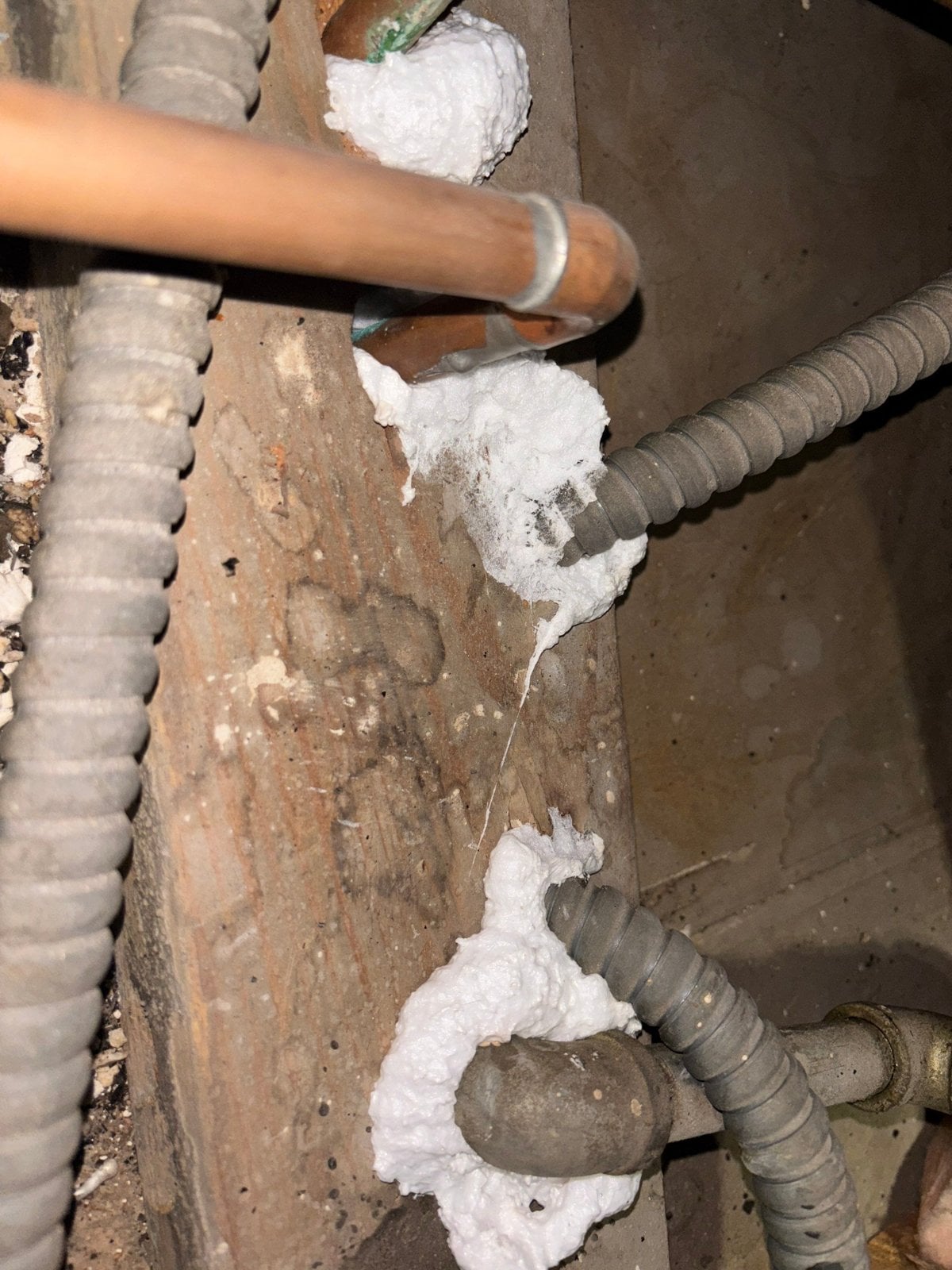 Foam air sealing around an attic penetration in Los Angeles