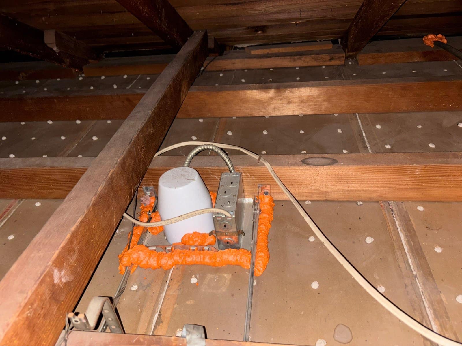 Foam air sealing around an attic penetration in Los Angeles