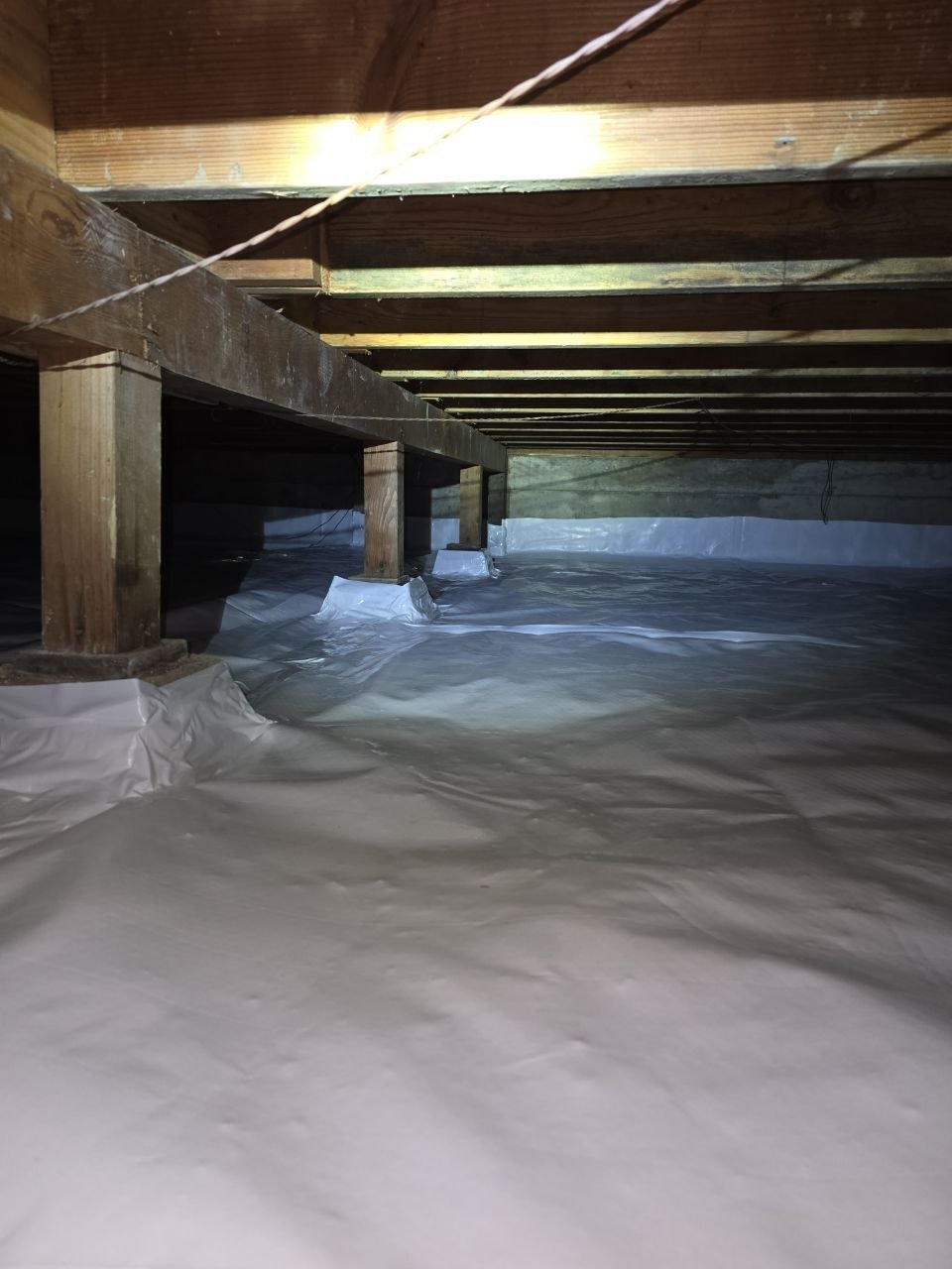 Monte Sereno crawl space after the job, new vapor barrier laid over the soil