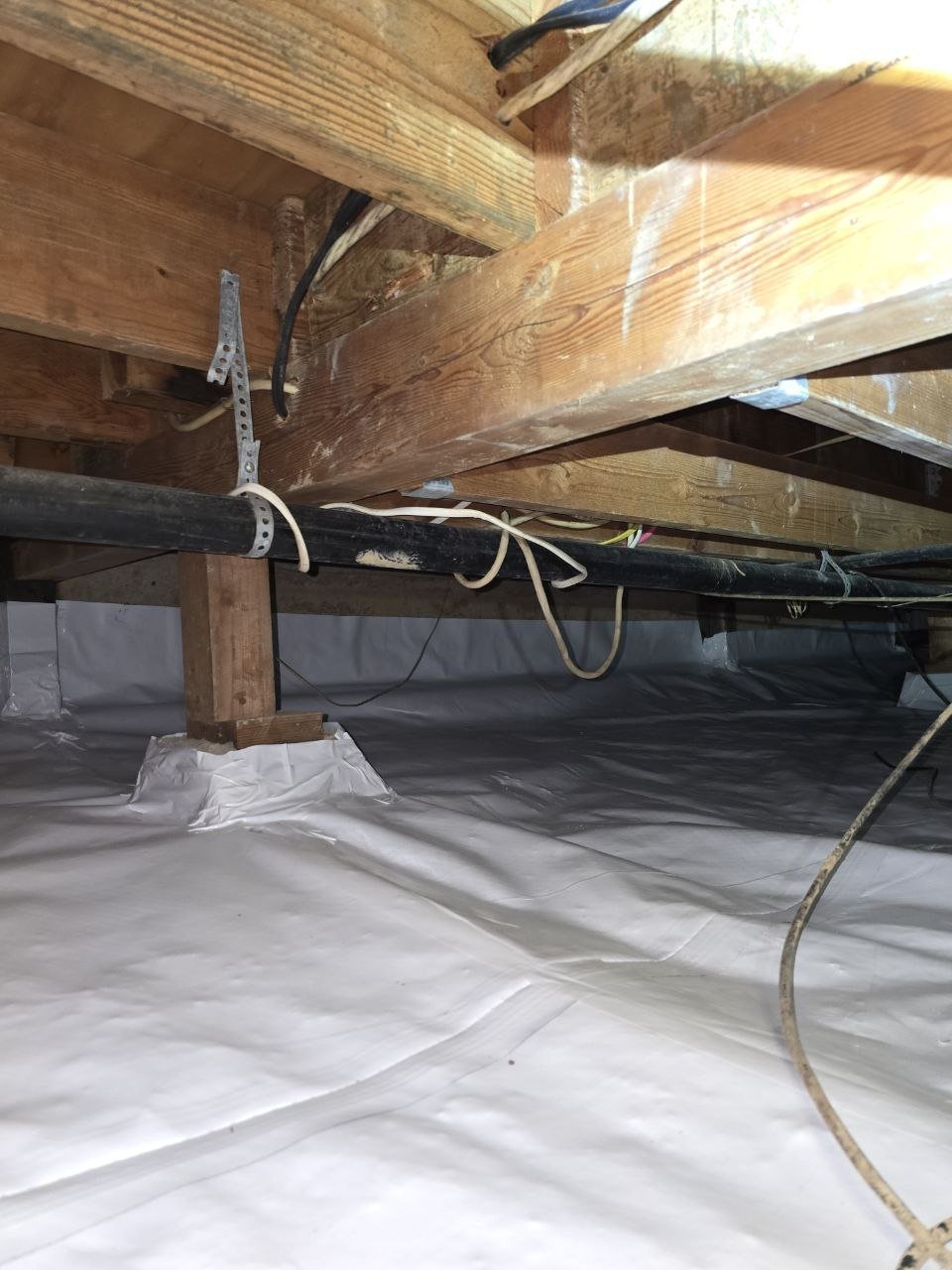 Vapor barrier sealed at a pier in a Monte Sereno crawl space