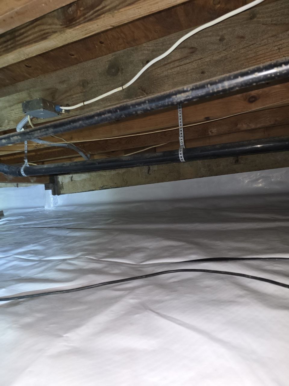New vapor barrier under pipes in a Monte Sereno crawl space