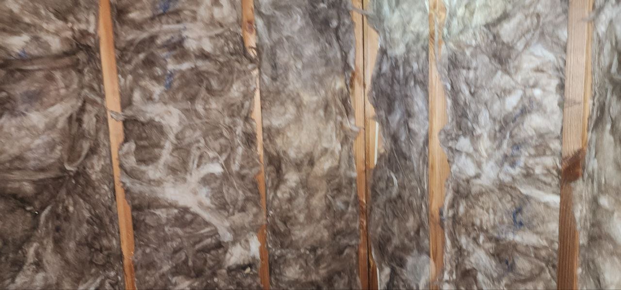 Another area of old insulation in the Mountain View attic before work