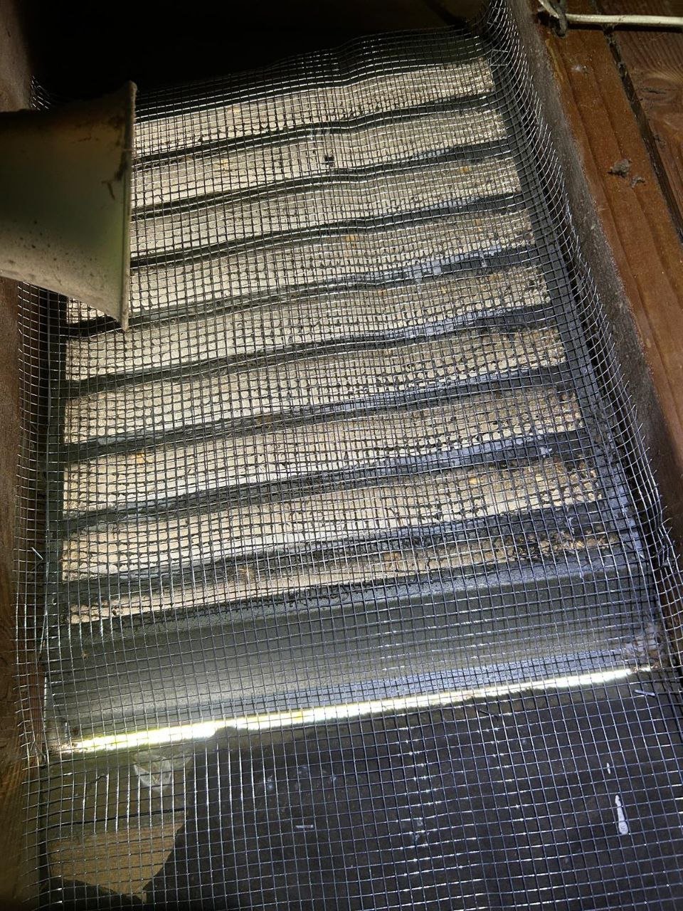 Attic vent screened with wire mesh in Mountain View