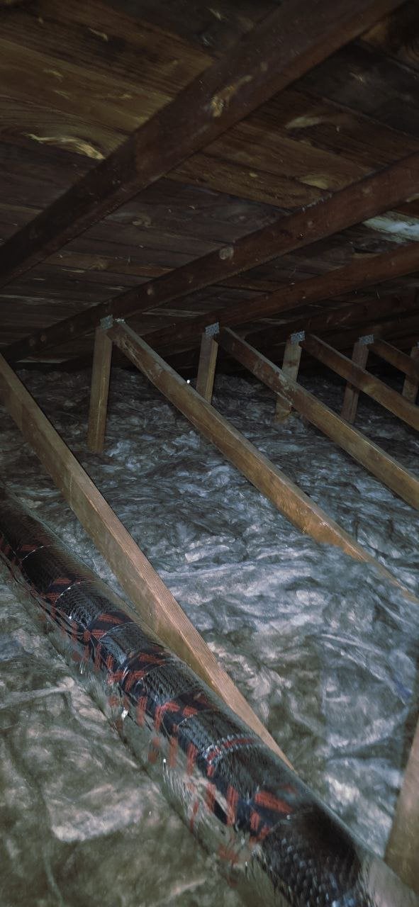 New insulation laid around ducts in a Napa attic