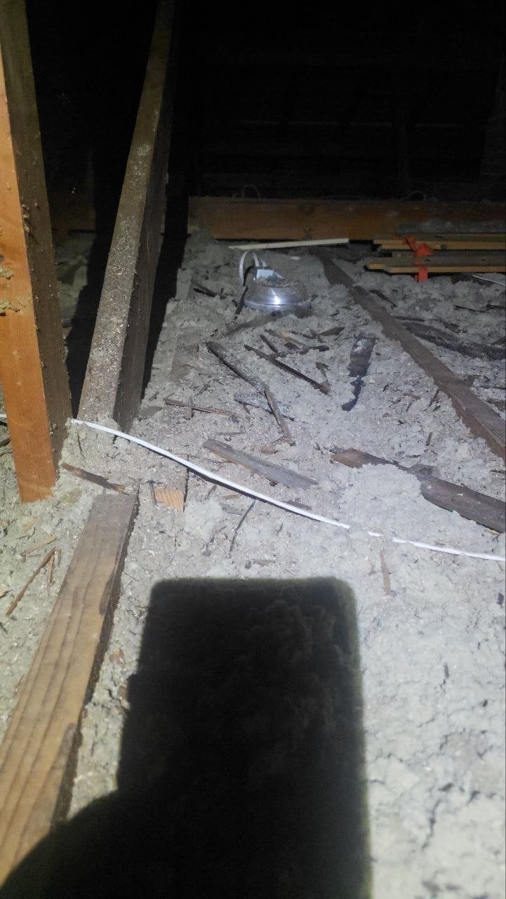 Old insulation being removed from the Oakland attic