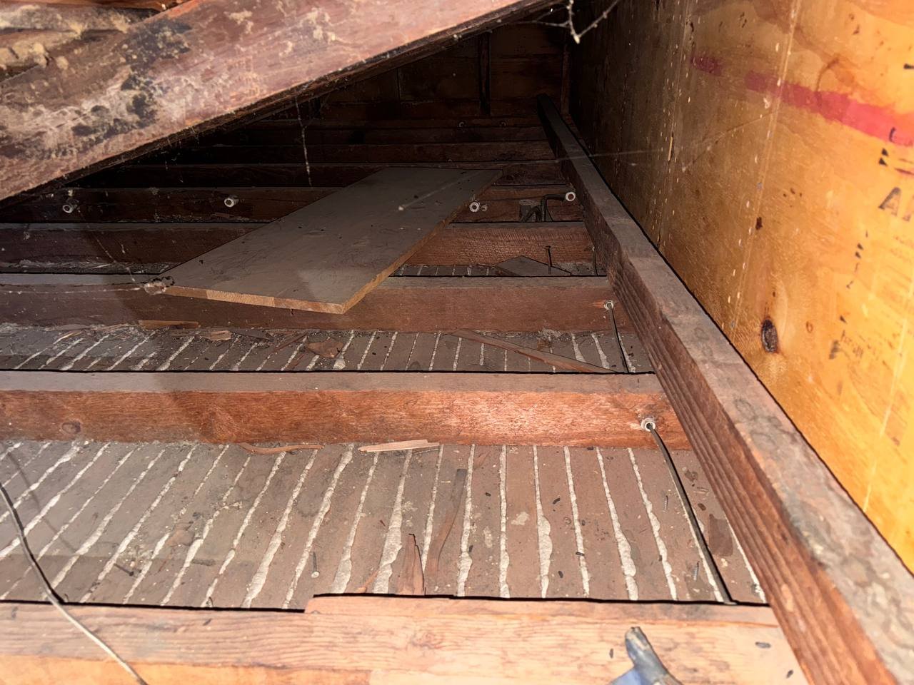 Cleared attic deck in a Oakland attic