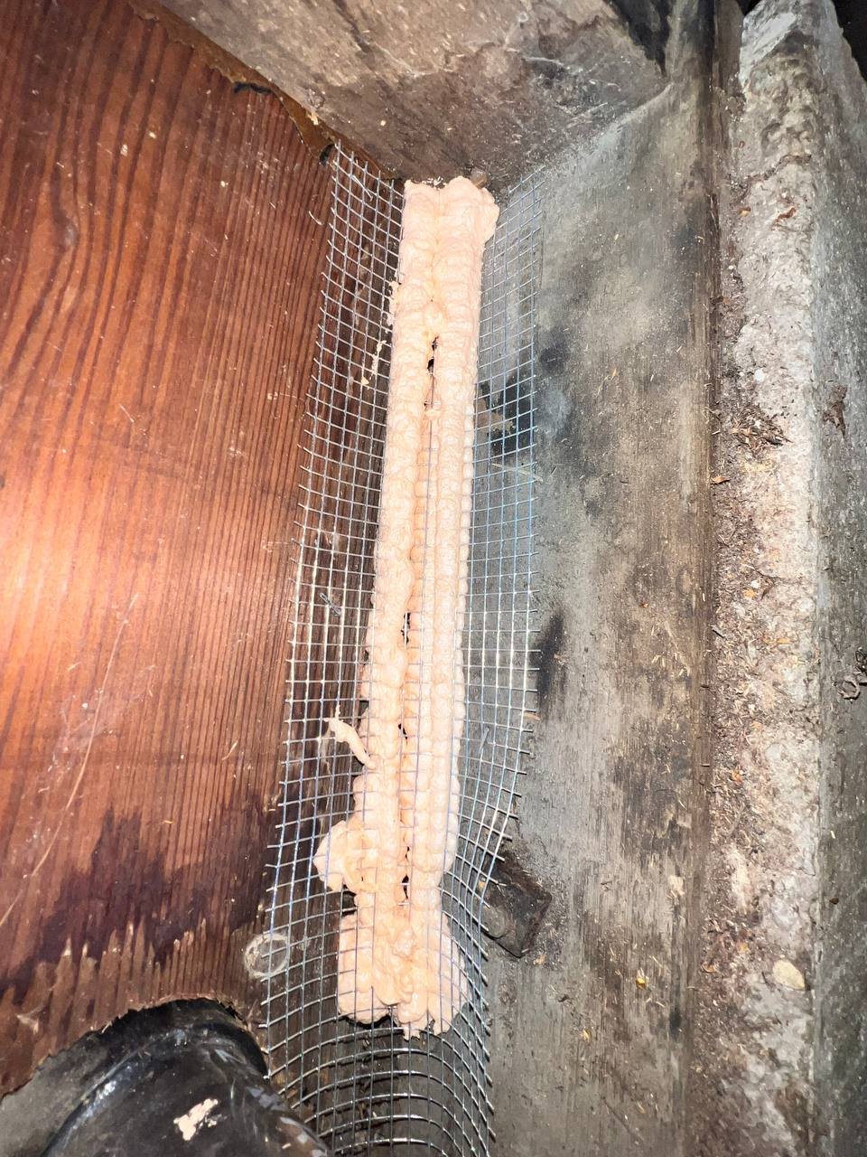 Vertical gap closed with wire mesh and foam in Oakland