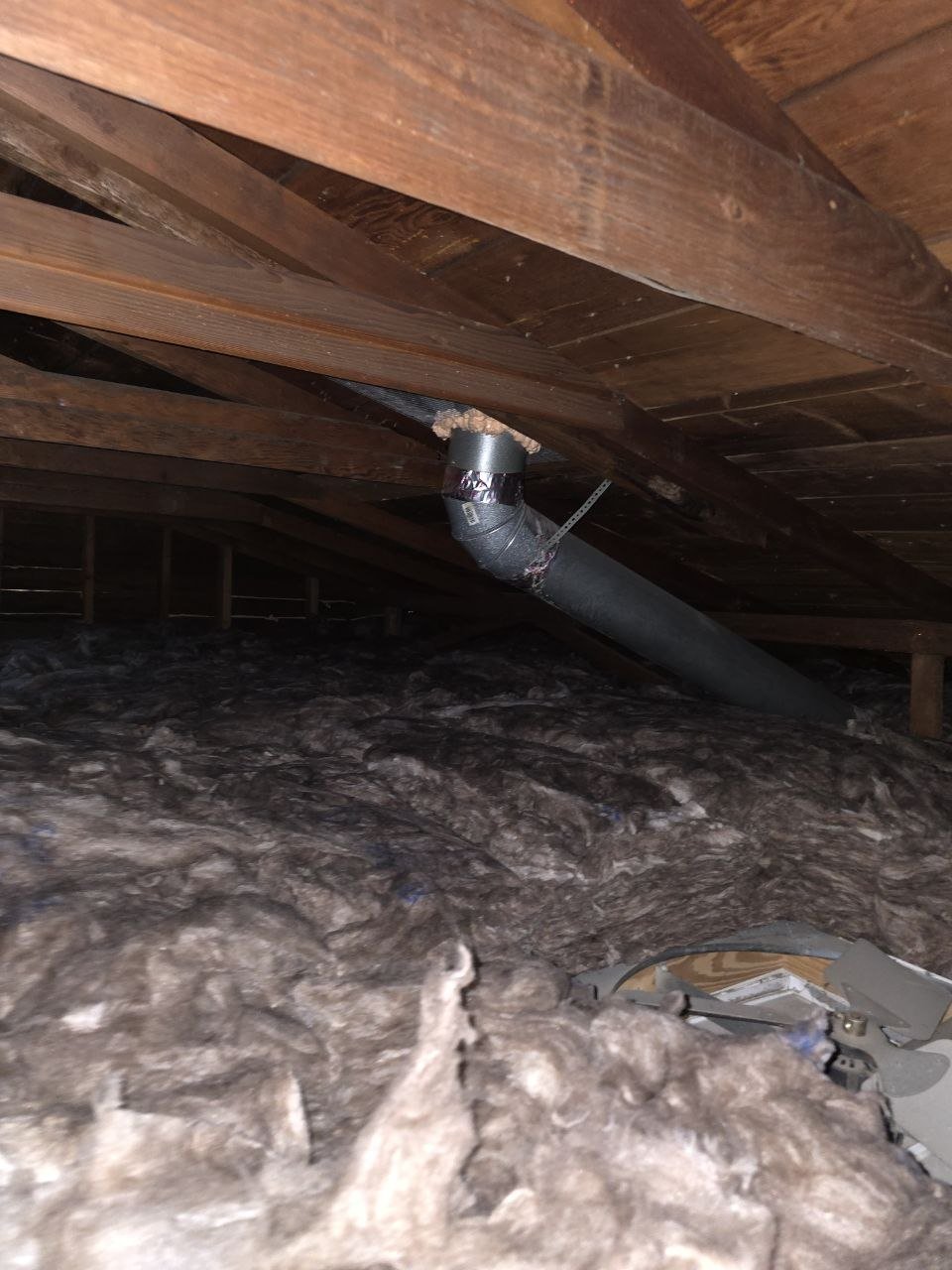 New insulation laid around ducts in a Oakland attic