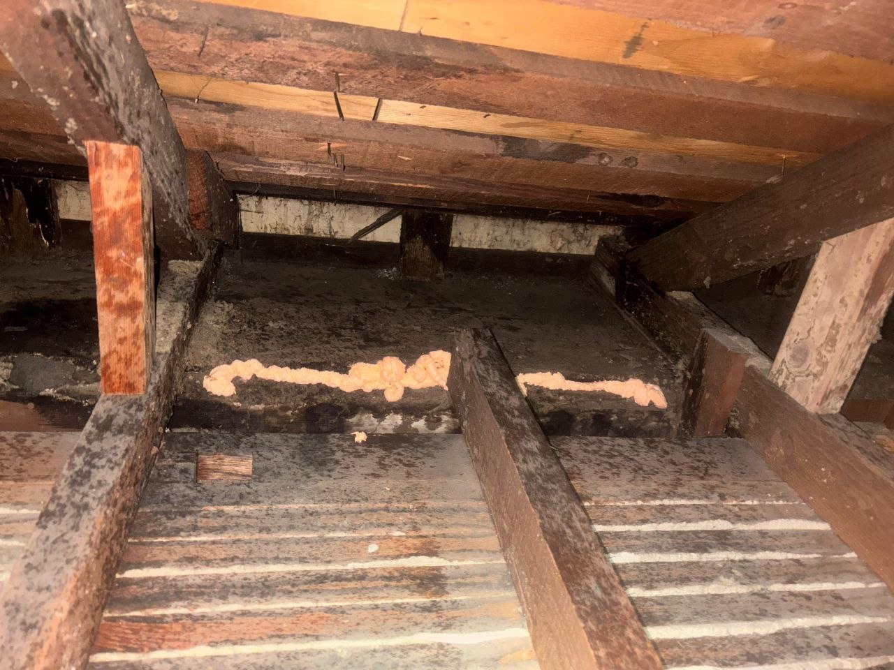 Polyurethane foam air sealing along attic framing in Oakland