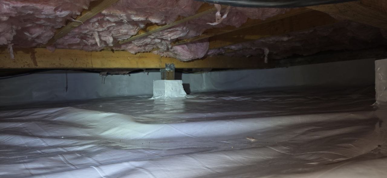 Pacifica crawl space after the job, new vapor barrier over the soil