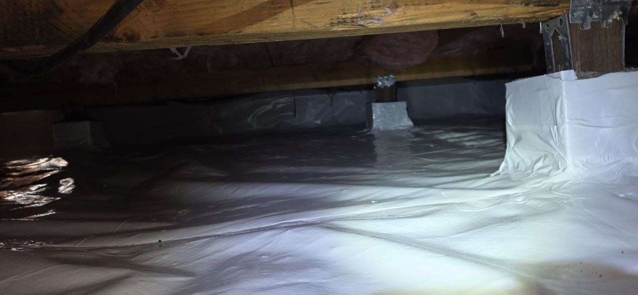 Crawl space pier wrapped with vapor barrier in Pacifica