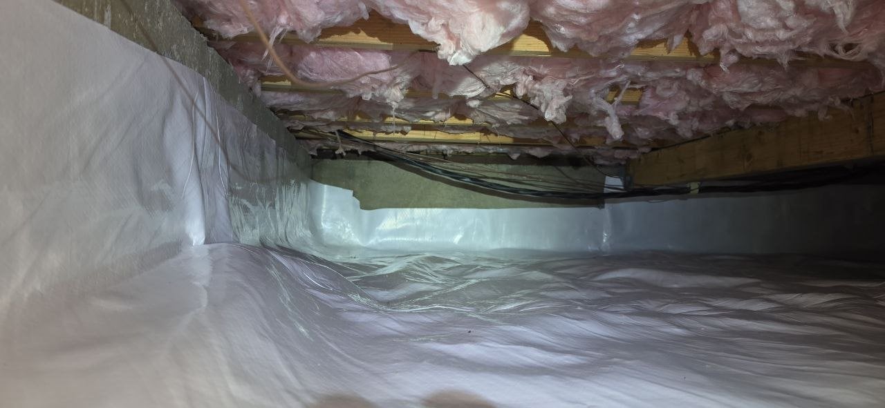 Vapor barrier along the perimeter wall of a Pacifica crawl space