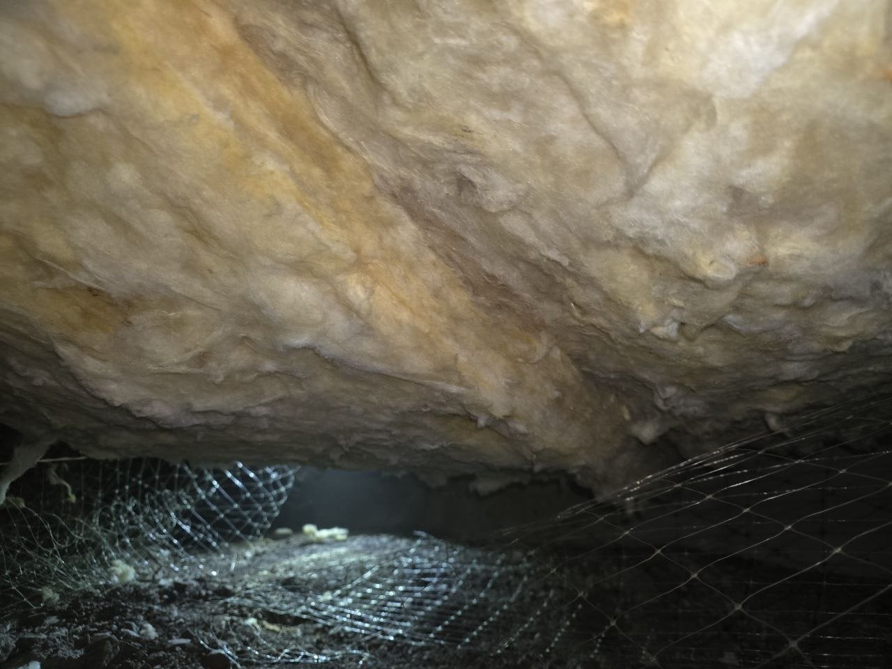 Another section of sagging old insulation in the Palo Alto crawl space