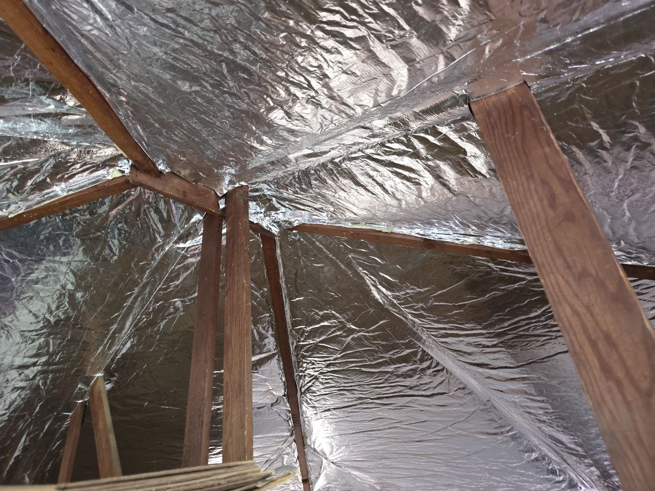 Radiant barrier across the rafters of a Palo Alto attic