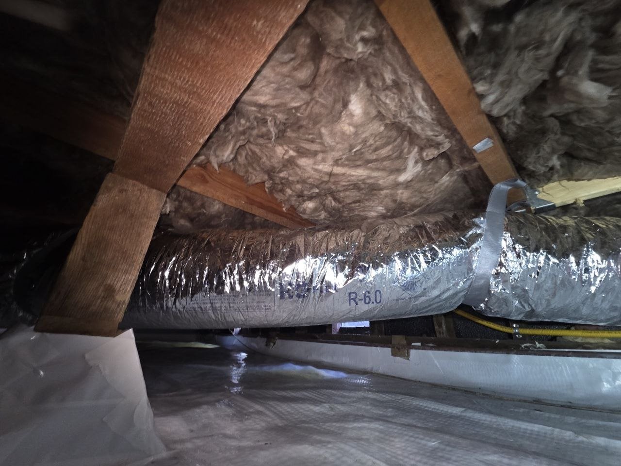 New flexible air ducts under new insulation in a Petaluma crawl space
