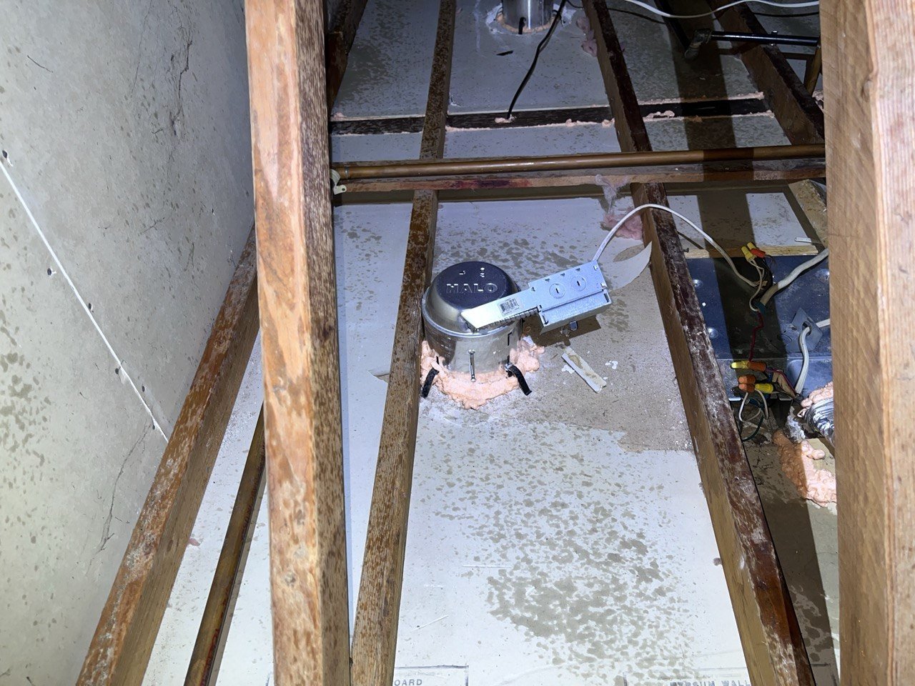 Foam air sealing around an attic penetration in Pleasanton