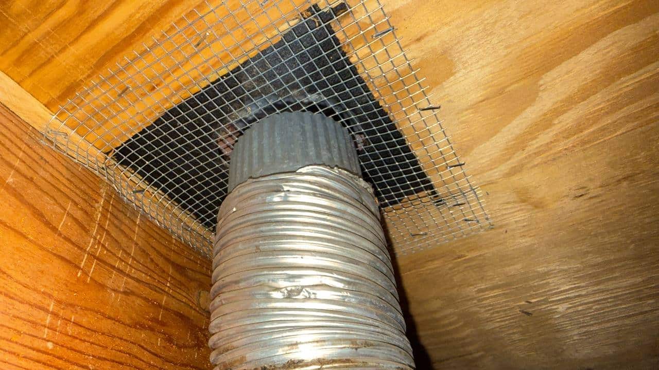 Wire mesh rodent proofing around a flue in a Pleasanton attic