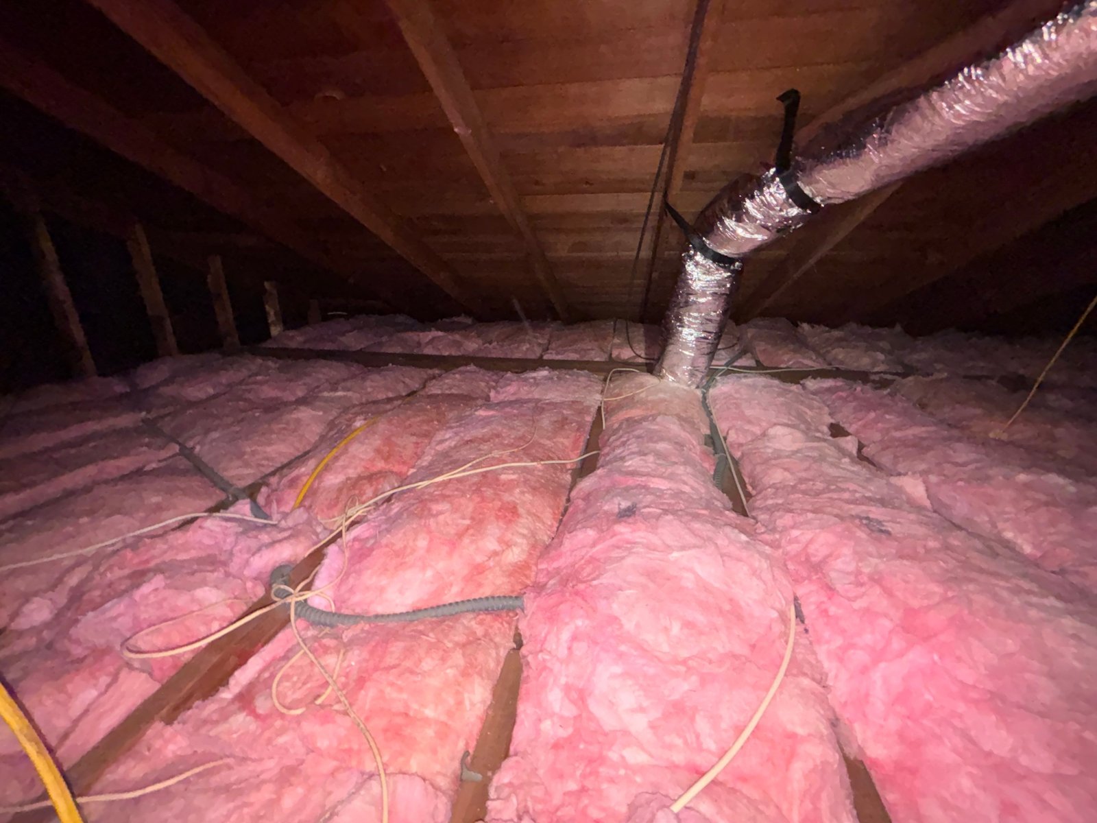 New flexible air duct over new insulation in a Redondo Beach attic