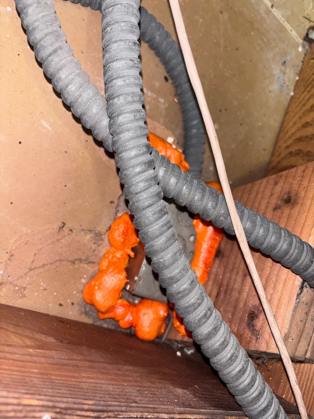 Foam sealing around conduit through attic framing in Redondo Beach
