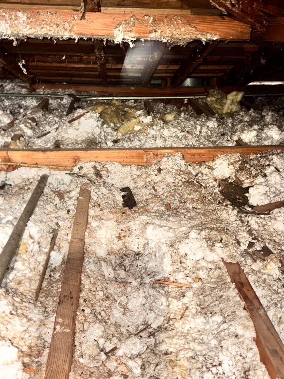 San Jose attic before work, old insulation and debris