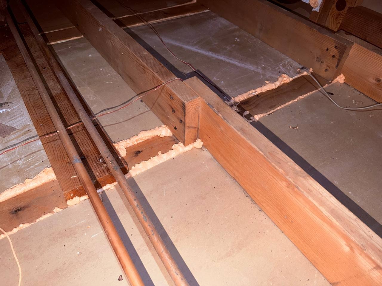Polyurethane foam air sealing along attic framing in San Jose