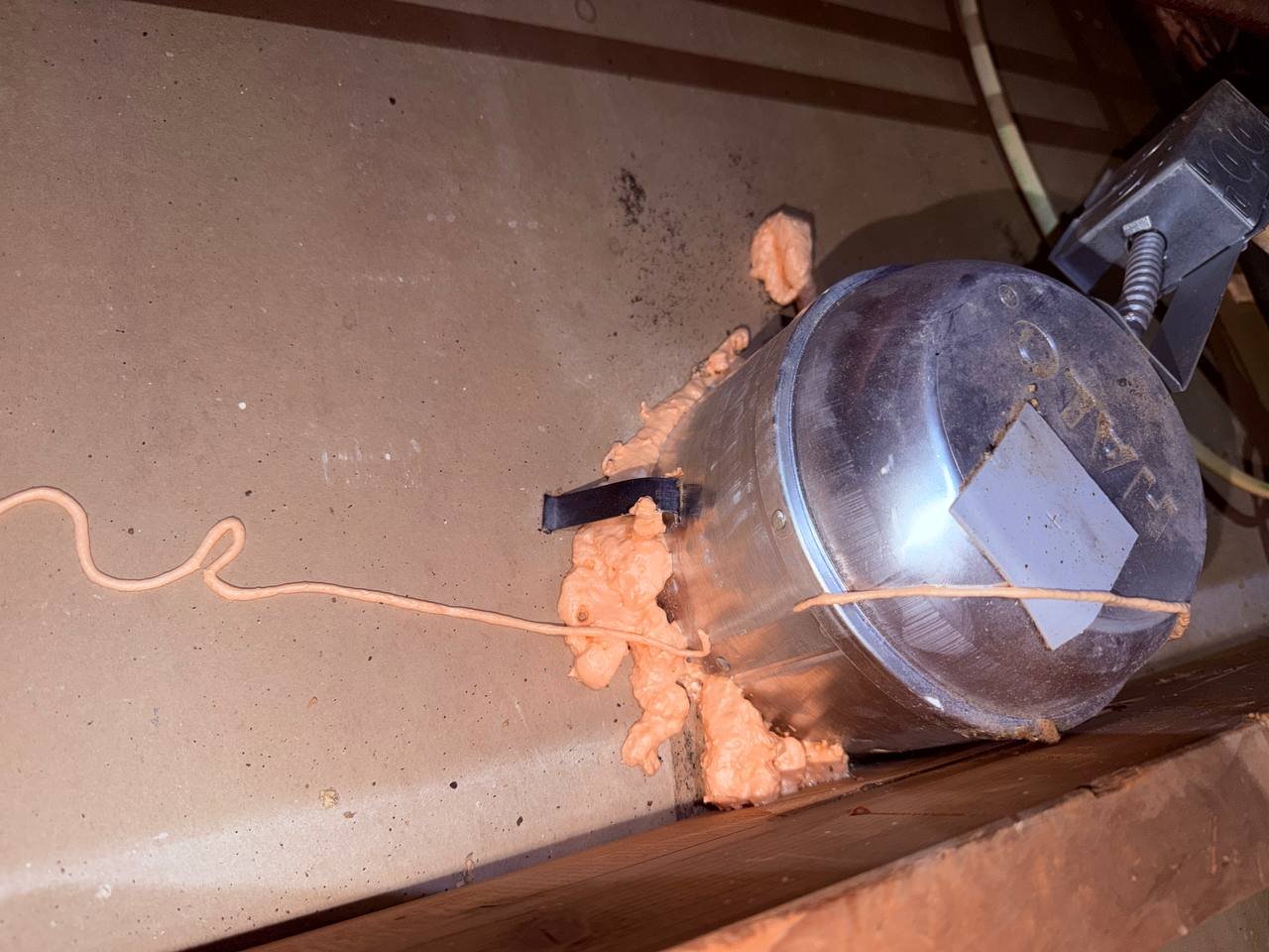 Foam air sealing around an attic penetration in San Jose