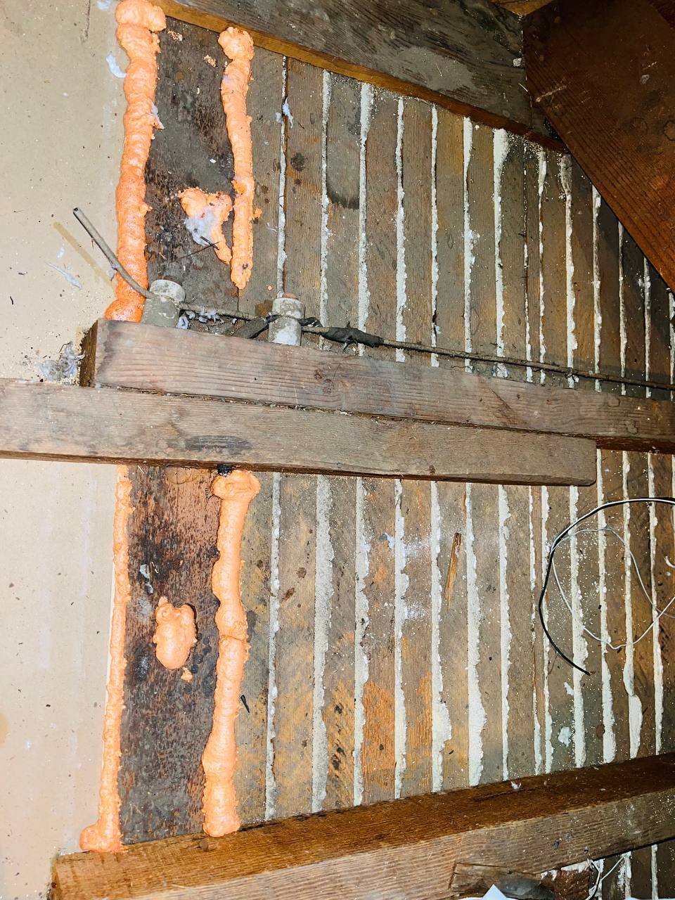 Polyurethane foam air sealing along attic framing in San Jose