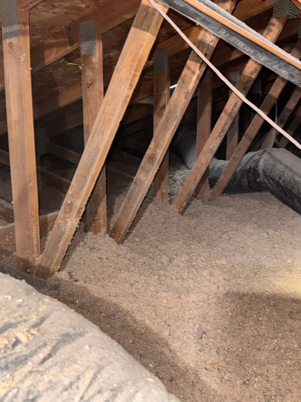 New cellulose insulation around attic framing in San Jose