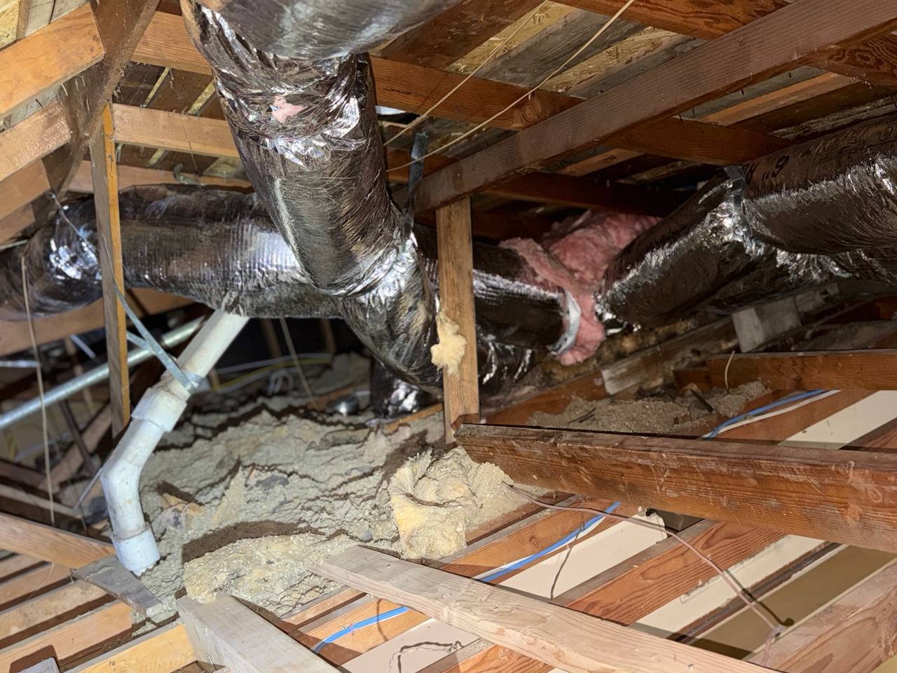 San Jose attic before work, old insulation and debris