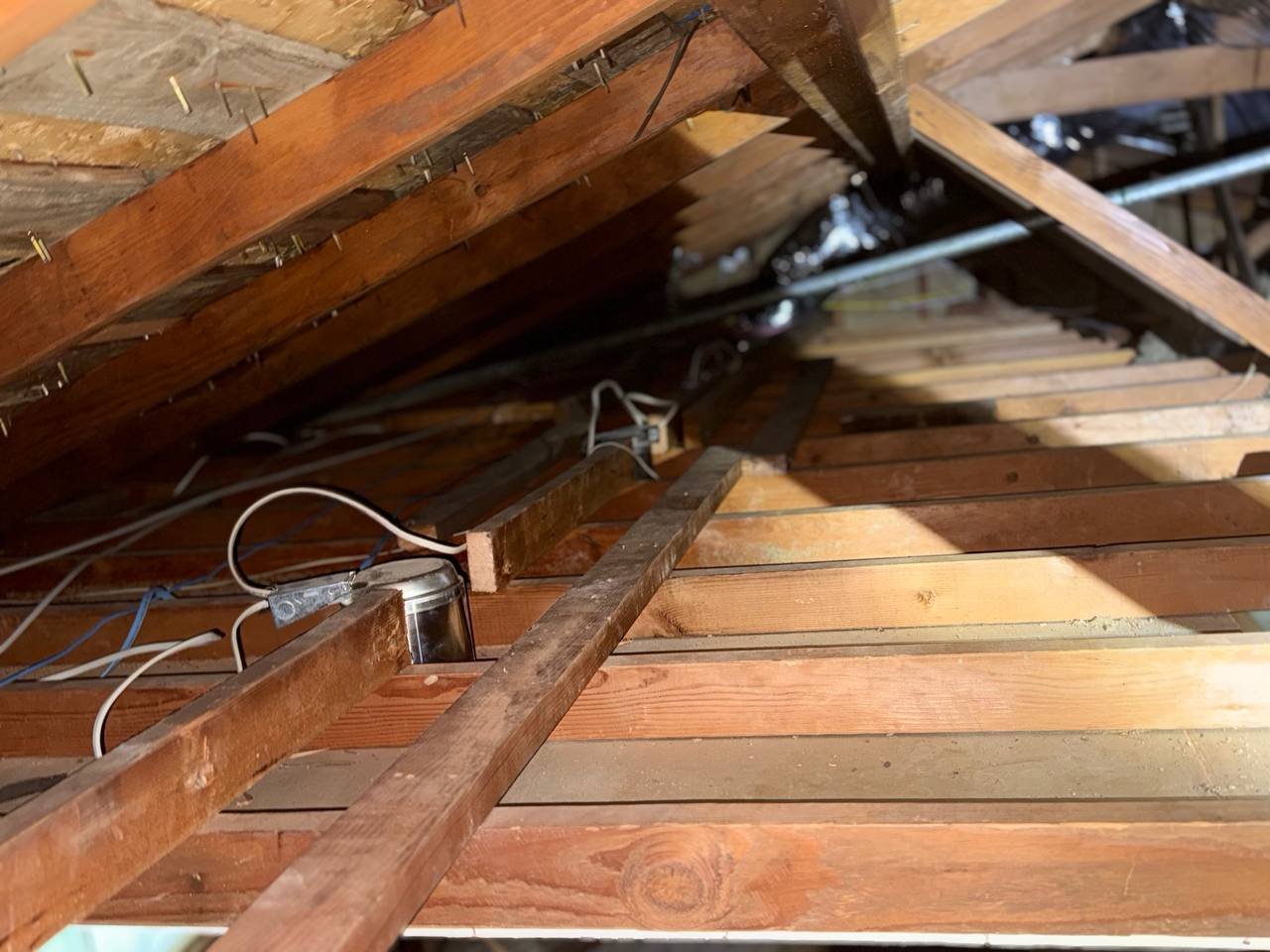 Cleared attic deck around wiring and a light fixture in San Jose