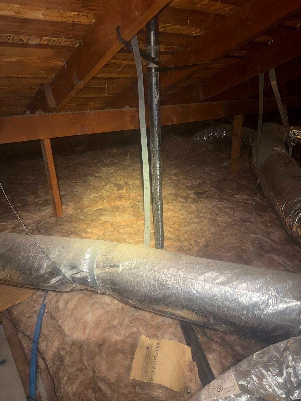 Another area of old insulation in the San Jose attic before work