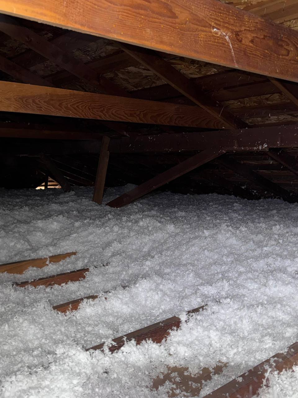 New blown-in insulation between attic framing in San Jose