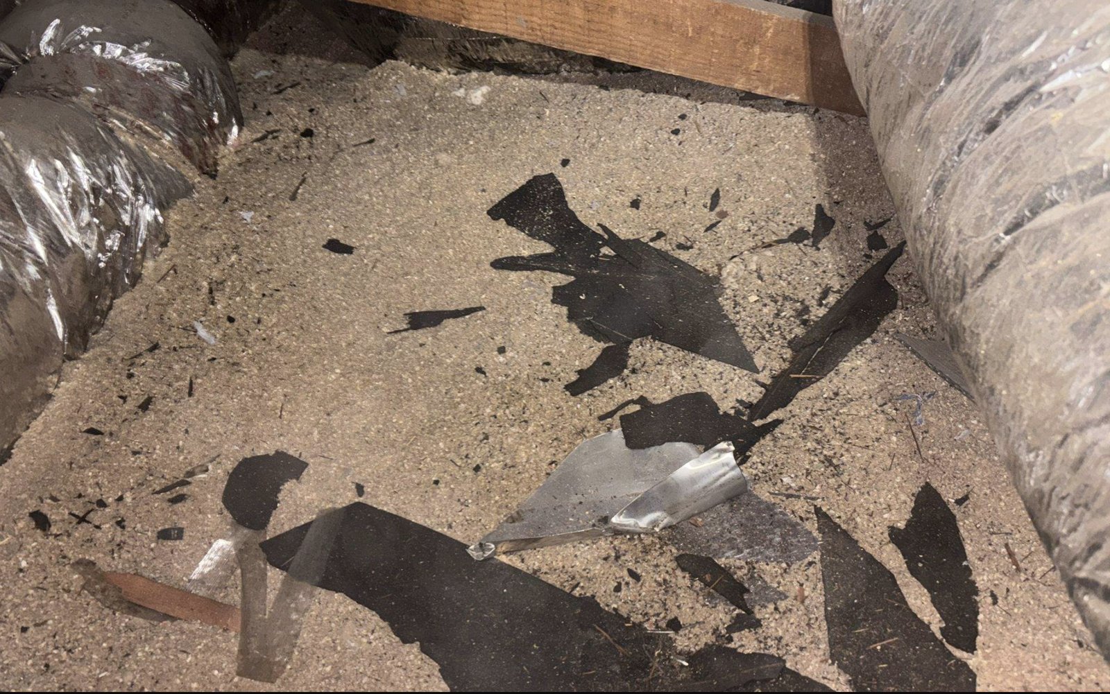 San Jose attic before work, old insulation and debris