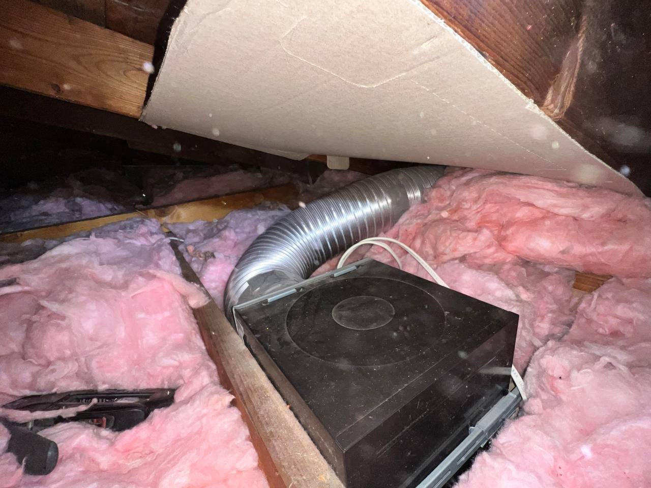 Flexible air duct connected at a register box in a San Jose attic