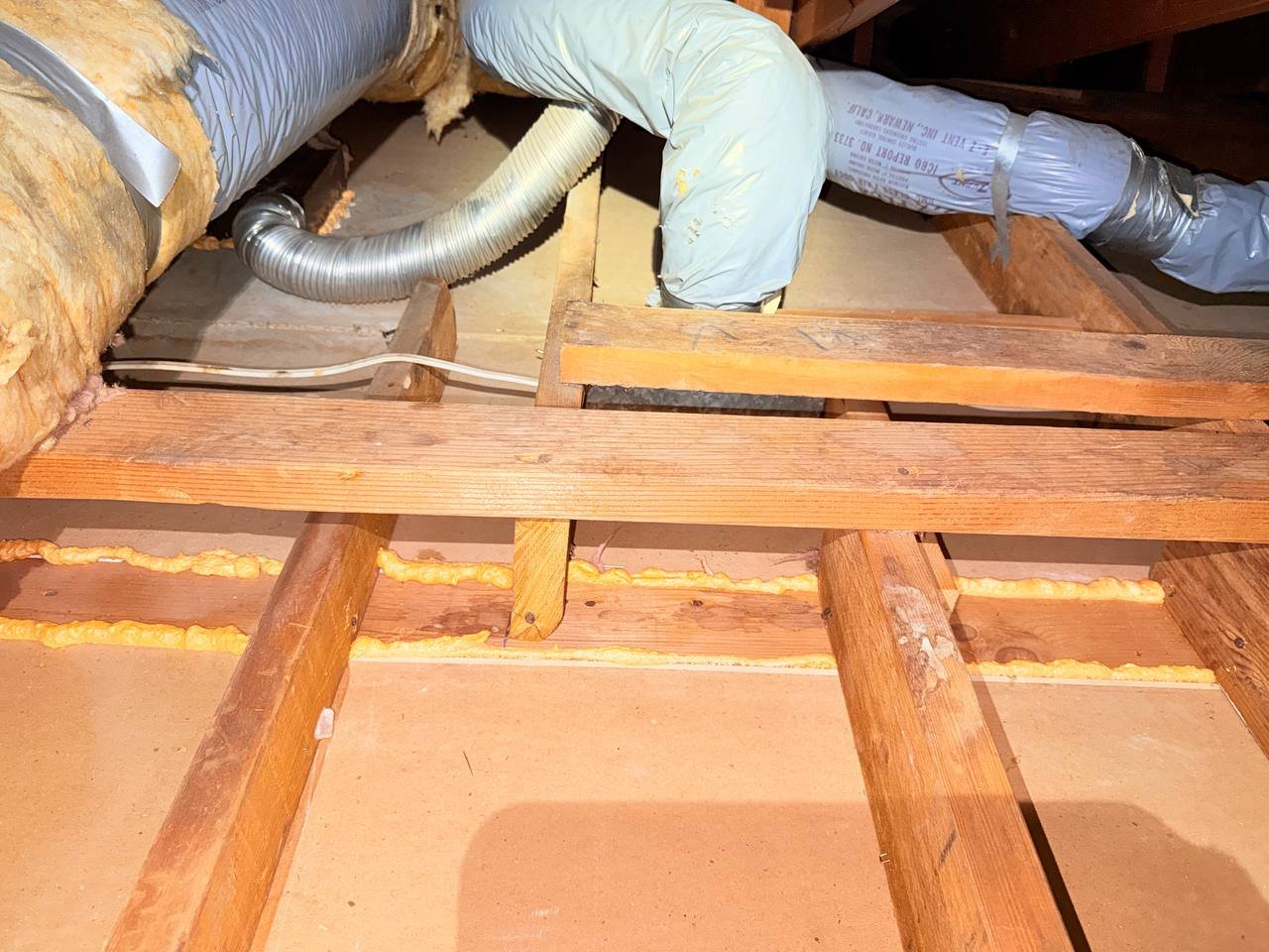 Polyurethane foam air sealing along attic framing in San Jose