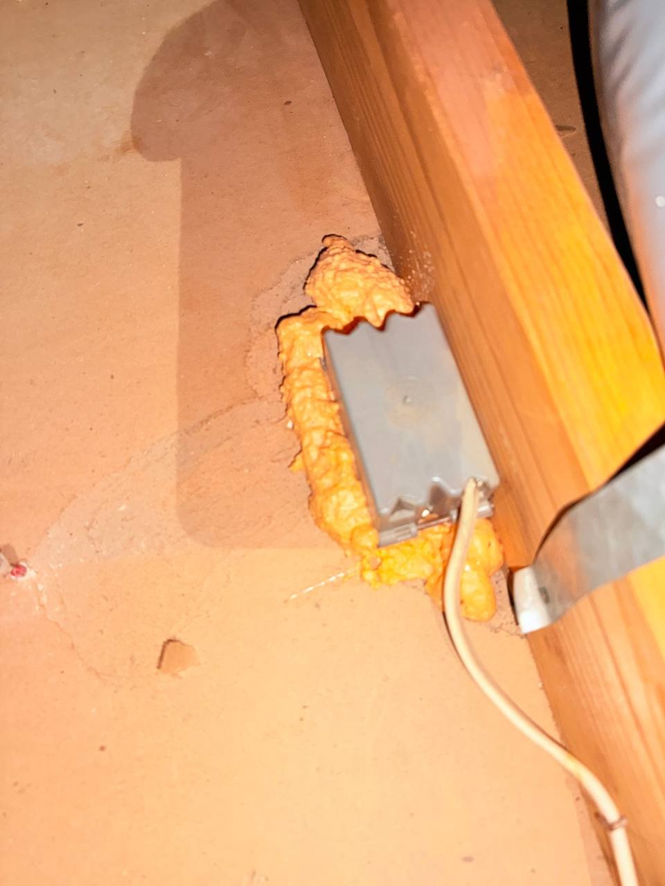 Foam air sealing around an attic penetration in San Jose