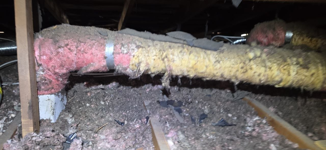 San Jose attic before work, old insulation and debris