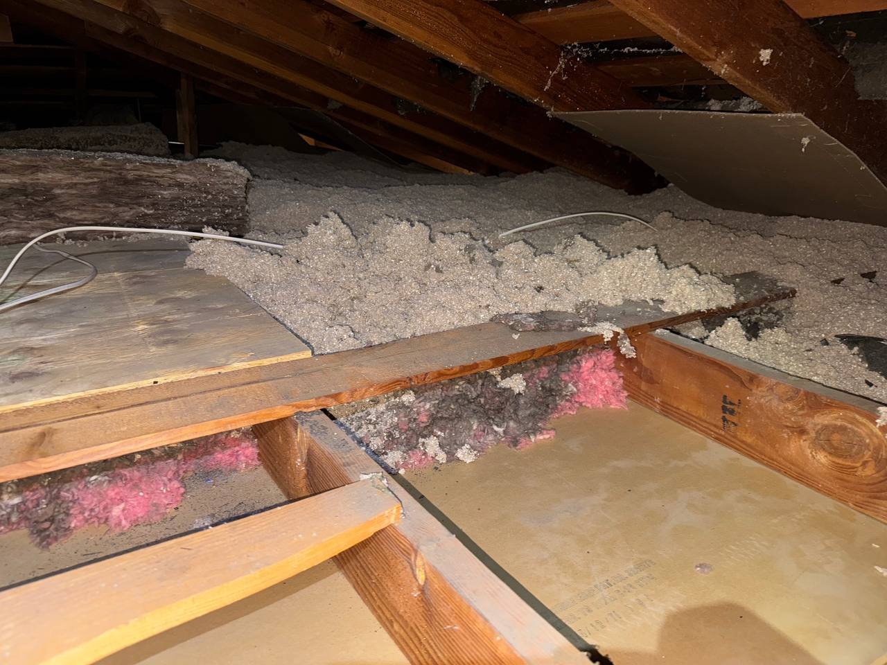 Old insulation being removed from the San Jose attic