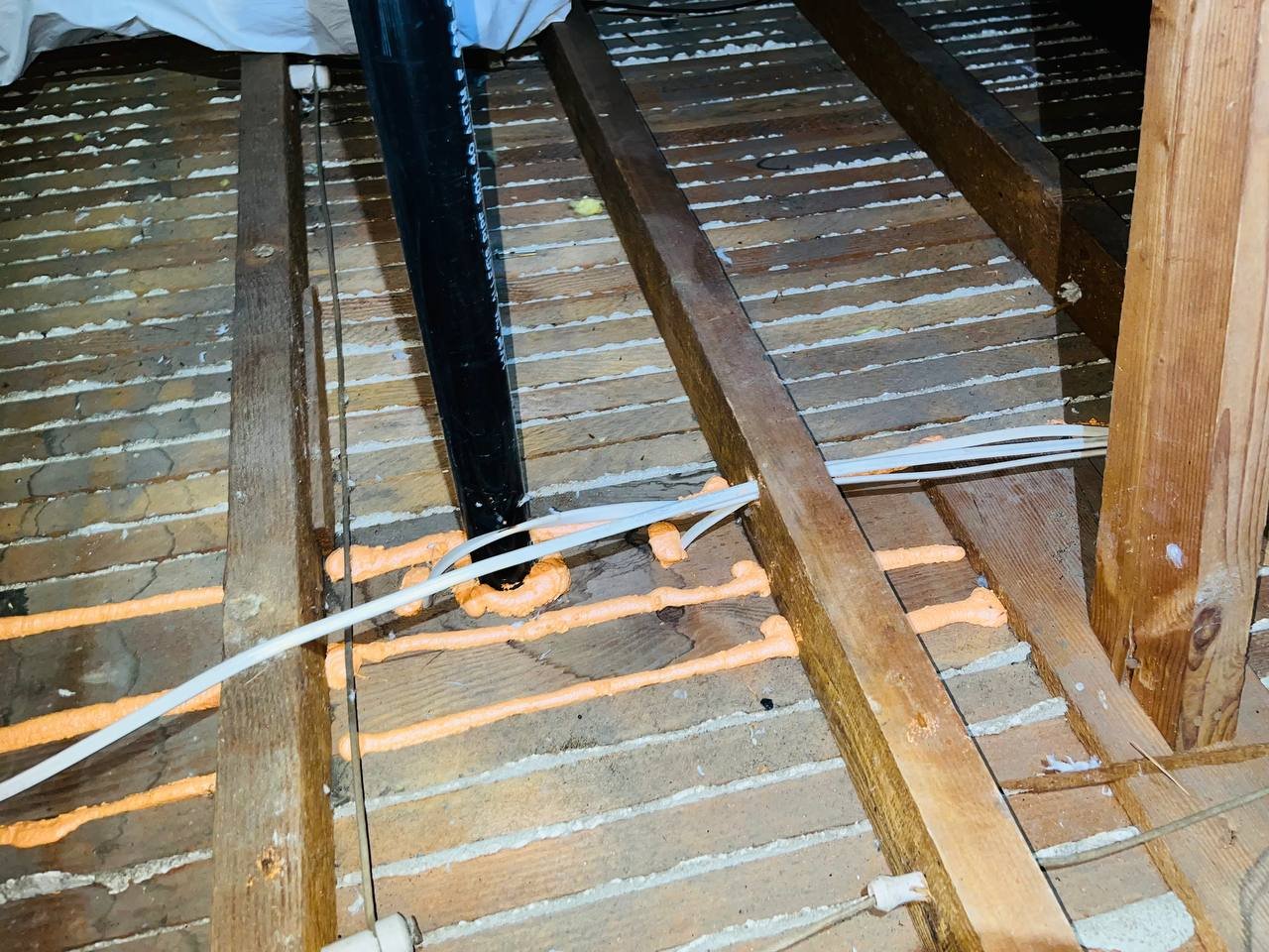 Polyurethane foam air sealing along attic framing in San Jose