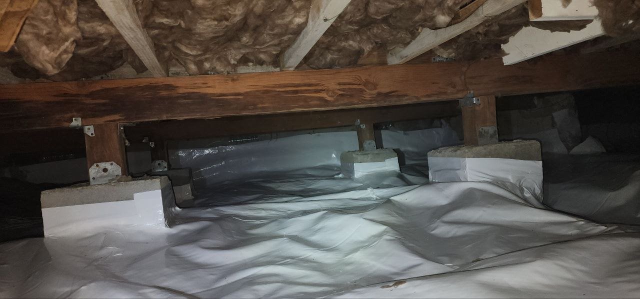 Vapor barrier sealed around crawl space piers in San Jose