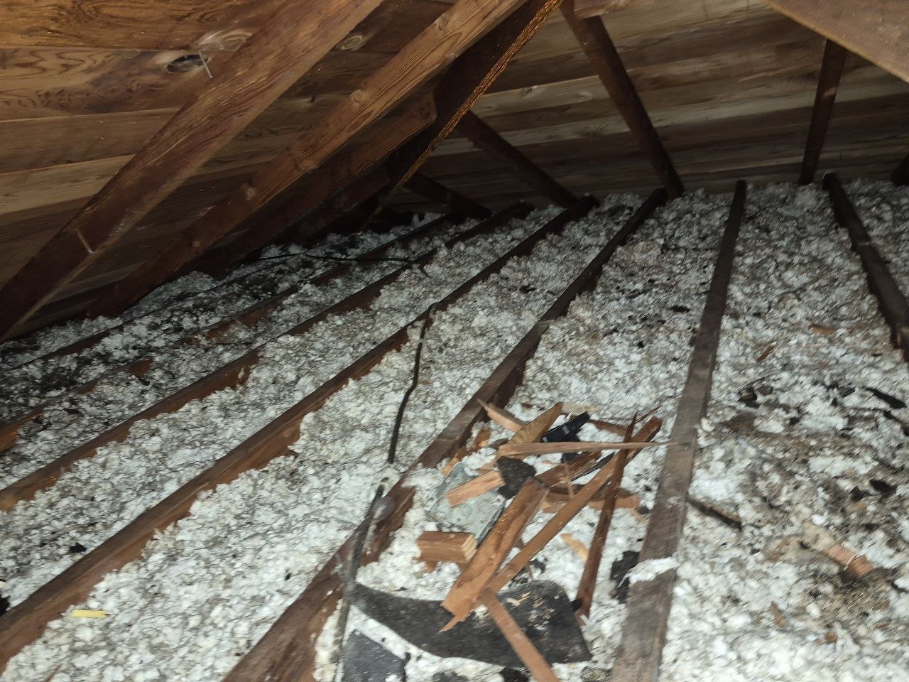 San Leandro attic before work, old insulation and debris
