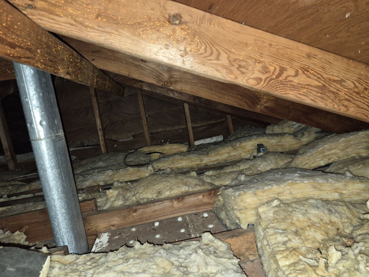 Another area of old insulation in the San Leandro attic before work