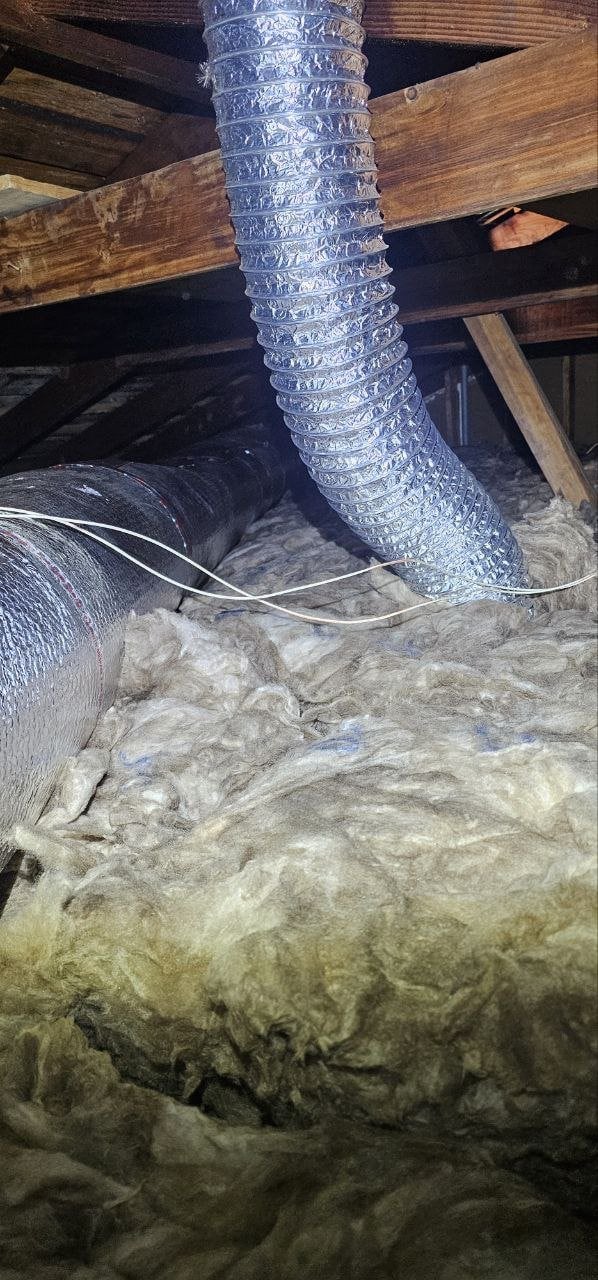 New flexible air ducts above new attic insulation in San Rafael