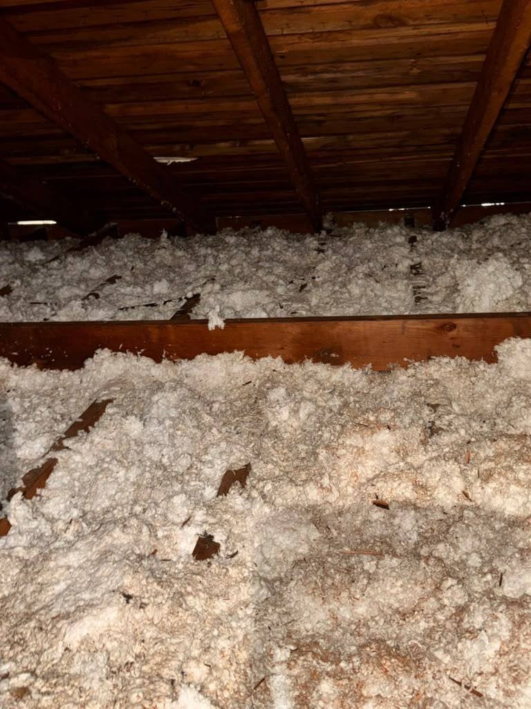 Another area of old insulation in the San Rafael attic before work