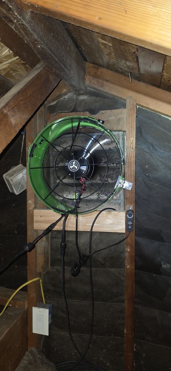 New attic fan in the gable wall of a Santa Clara attic