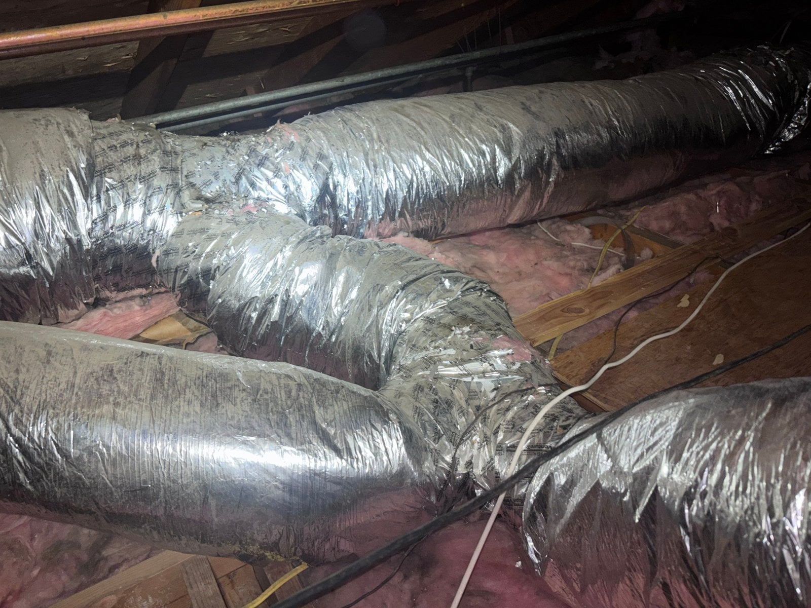 New flexible air ducts over new insulation in a Santa Clarita attic