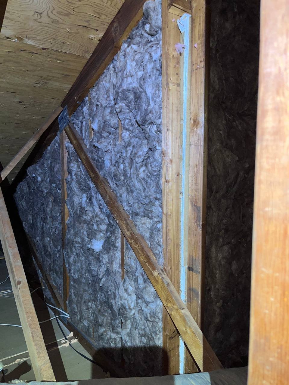 New insulation batts in attic wall framing in Santa Rosa
