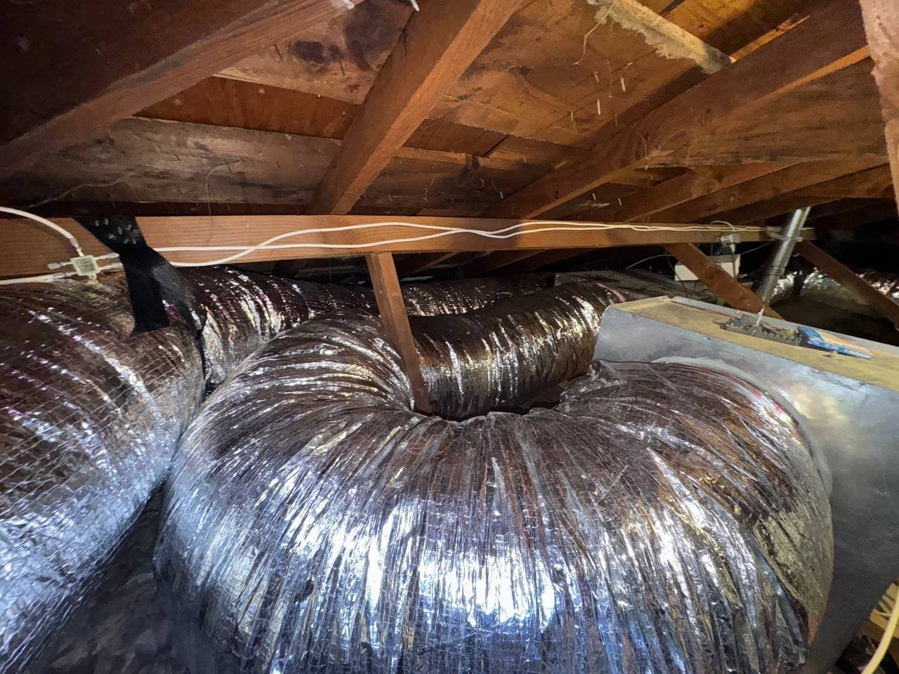 New flexible air ducts in place in a Santa Rosa attic
